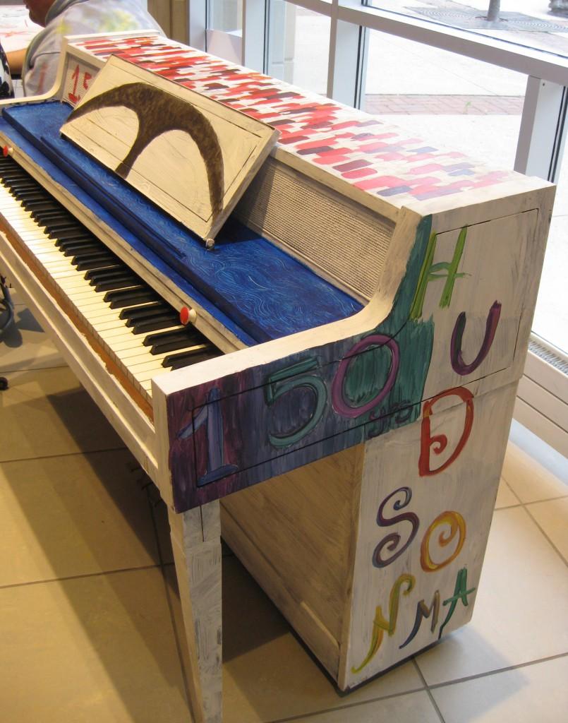 The unfinished piano for Hudson’s 150th anniversary debuts at the Art Show. | by Stephanie Petrovick